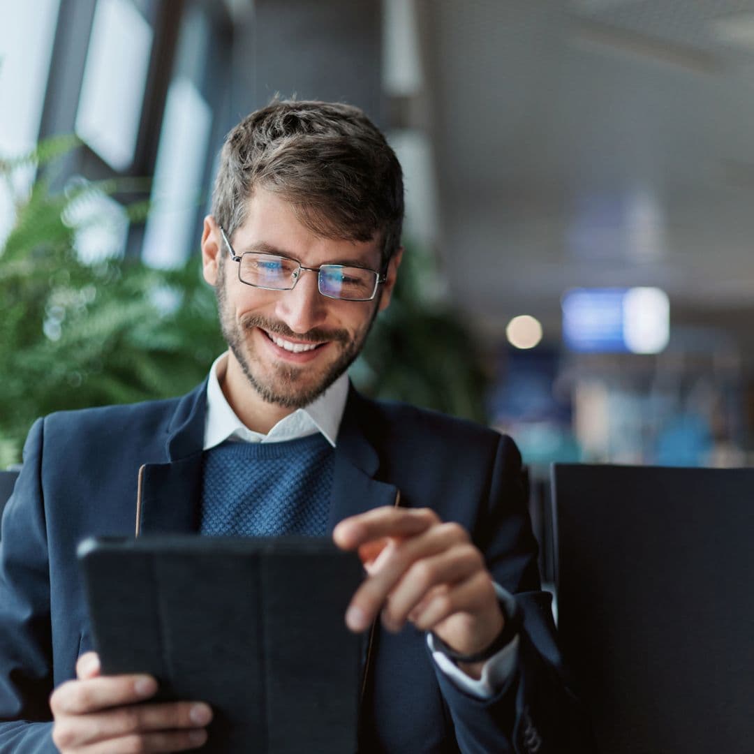 Man reading news on electronic device